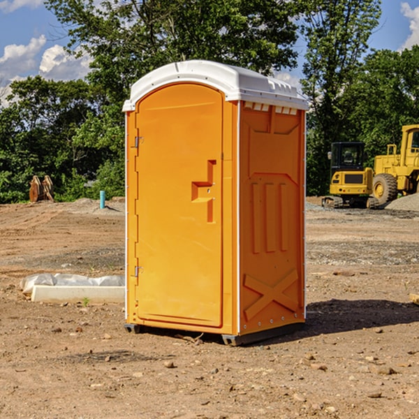 what is the cost difference between standard and deluxe portable restroom rentals in New Holland